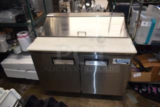 Avanco refrigeration prep table with stainless steel exterior and dual doors, in good condition, ideal for commercial kitchens.