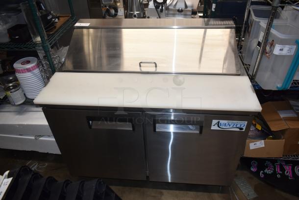 Avanti refrigerator with stainless steel top, white cutting board, dual doors, and visible brand label. Good condition.