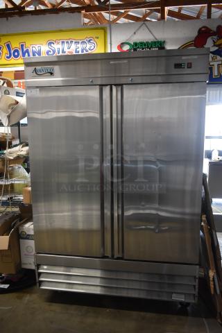 Stainless steel Avantco refrigerator with double doors, good condition, commercial-grade, visible markings on top panel.