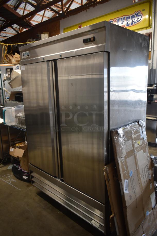 Avantco stainless steel commercial refrigerator, double-door, visible wear, dents. Ideal for kitchens, storage.