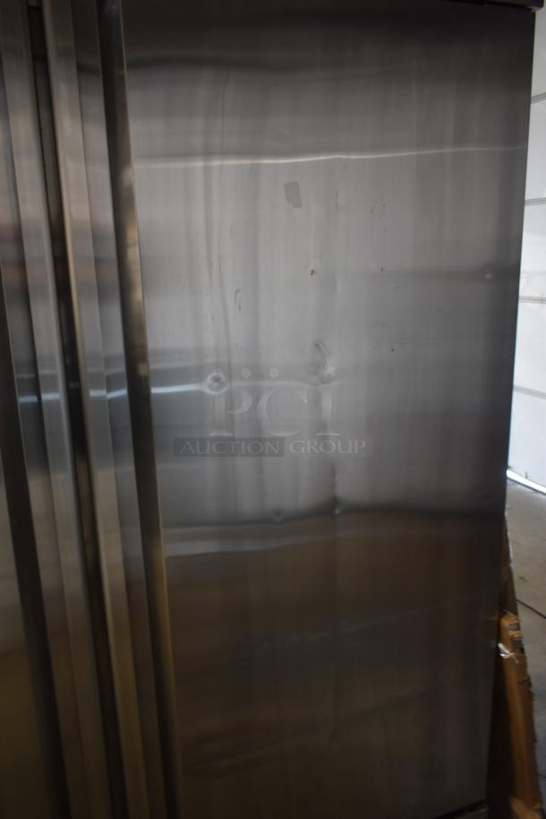 Stack of stainless steel panels with brushed finish, slight surface imperfections, ready for industrial or architectural use.