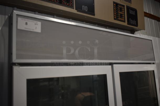 Vintage scoreboard with light-up display and control panel, showing wear. Features teams and fouls indicators. Tag reads "8."