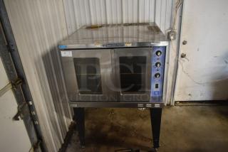 Bakers Pride commercial convection oven, stainless steel, double-door, three dials, used condition, model label visible.