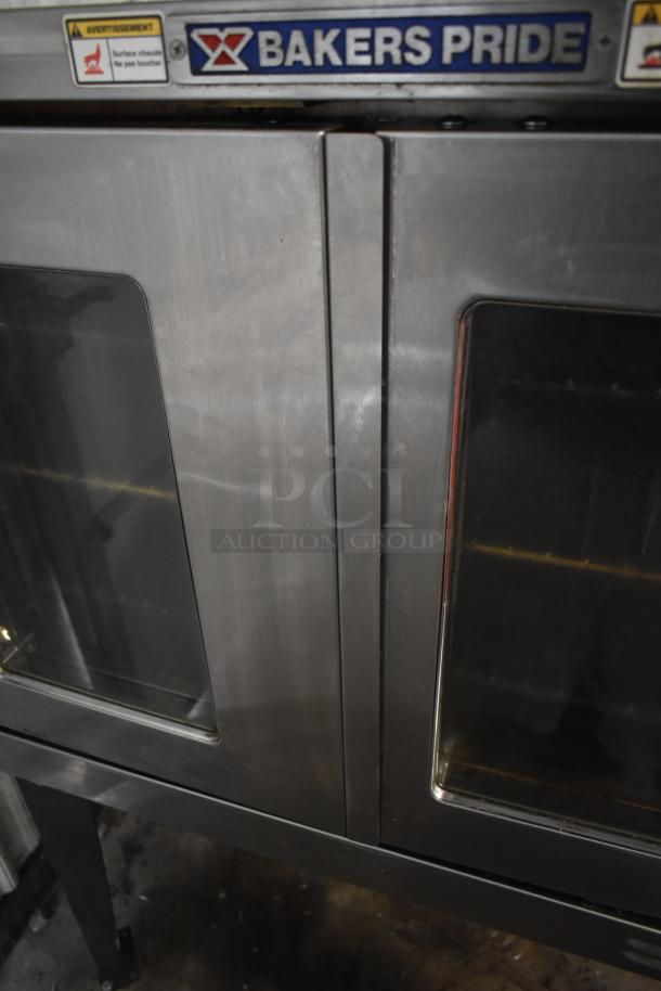 Bakers Pride commercial oven, stainless steel, double doors with glass windows, branded label, minor surface wear.