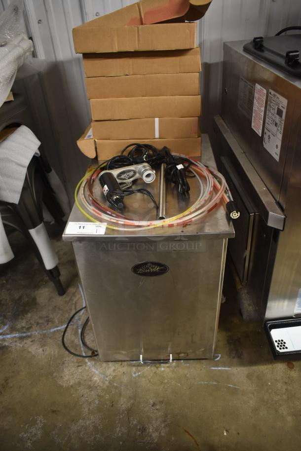 Stainless steel beverage tower with hoses and electronic pump, marked as model "Schluftz Wulf," appears in used condition.