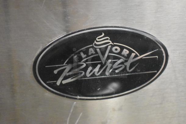 Close-up of "Flavor Burst" logo on stainless steel, indicating a specialized food or beverage machine.