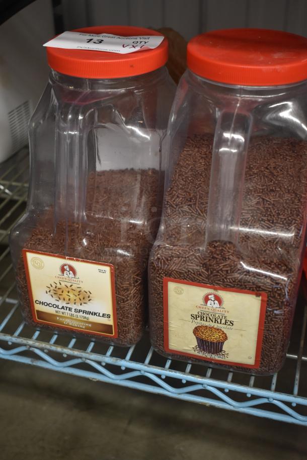 Two large containers of Chef's Quality chocolate sprinkles, each 7 lbs, with red lids and labels for decorating and baking.