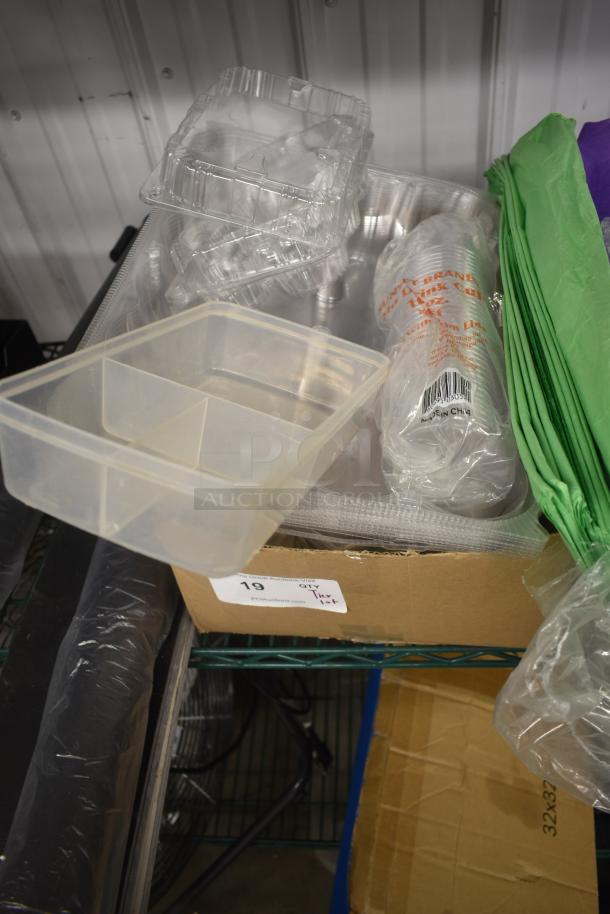 Box of assorted plastic containers and cups, including clear lids and trays. Includes labeled plastic cups. Auction tag "19".