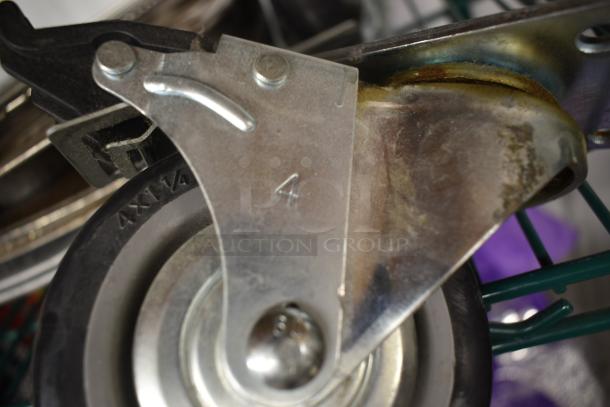 Metal caster wheel with bracket, marked "4", shows light wear. Features a black rubber tire and swiveling mechanism.