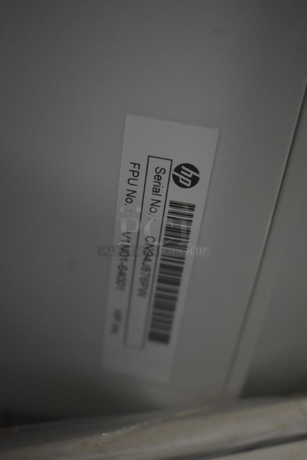 HP product label with serial number: CN94J67SPM and FPU number: V1N01-64001, indicating model and authenticity.