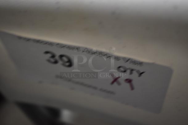 Blurry label showing "39" and "QTY X9" on a light-colored surface, indicating auction item details.
