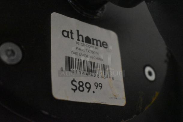 Price tag for an item from "at home," marked $89.99, indicating origin in China with barcode and location in Plano, TX.