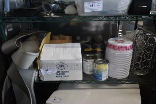 Shelf containing a box labeled "P&H Water Fountain," plastic cups, paint cans, and various hardware items. Box indicates model PH#255020, made in Taiwan.