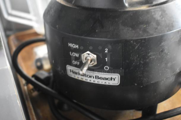 Hamilton Beach commercial blender base with a toggle switch for high, low, and off settings. Slight wear visible.