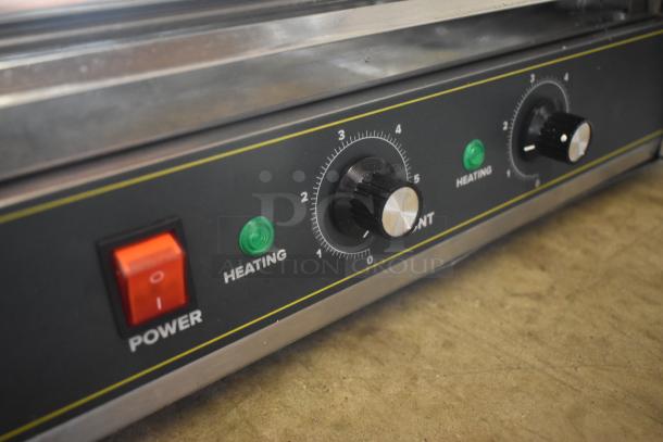Commercial grill control panel with power switch, dual heating knobs, and indicator lights. Good condition.