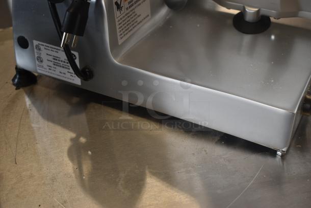 Commercial meat slicer base, Globe model 3850N, stainless steel, visible power cord, safety and model labels attached.
