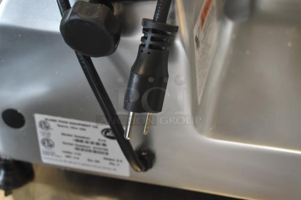 Electric appliance with power cord, featuring a label indicating "Model: Cheese C 32" by Glimek Food Equipment Co., Dayton, Ohio. In good condition.