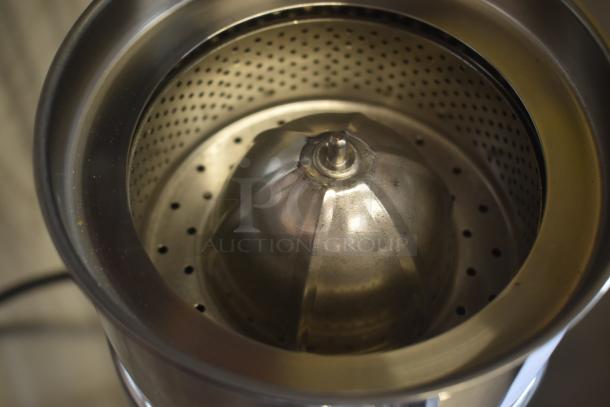 Stainless steel juicer cone with perforated strainer, in good condition, suitable for citrus juicing.