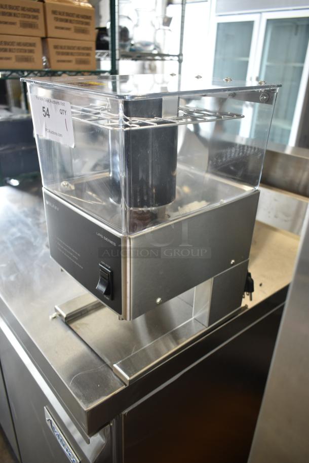 Grindmaster coffee grinder, model LPS Series, stainless steel, clear hopper, used condition, visible auction label.