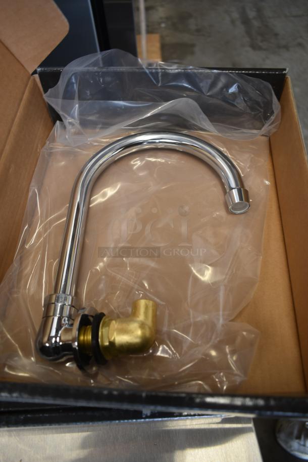 Chrome kitchen faucet with brass connector, new in box, packaged in clear plastic.