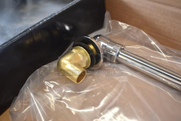 Brass and chrome plumbing valve, new in packaging, with black gasket and elbow joint for secure connections.