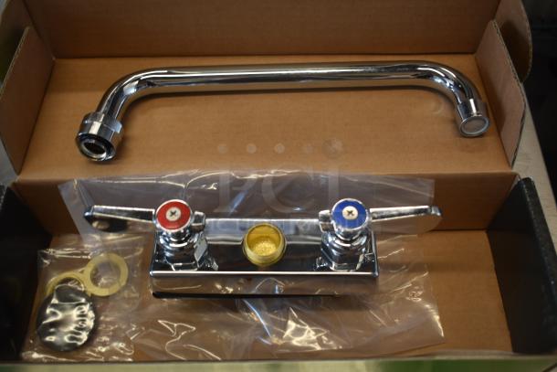 Chrome kitchen faucet set in box, featuring a swivel spout and dual-handle controls for hot and cold water, unused condition.