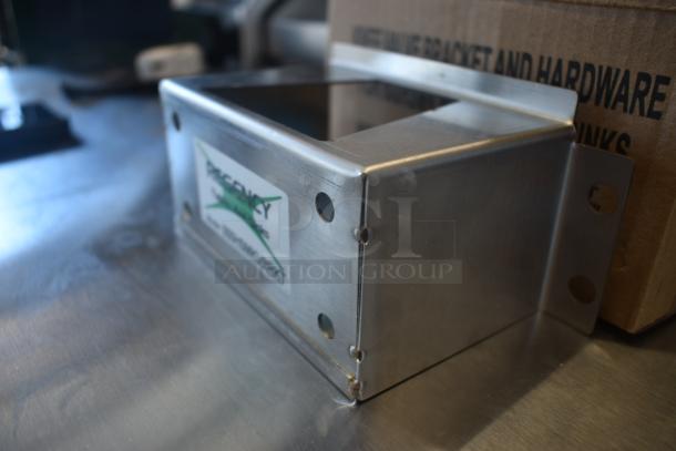 Stainless steel wall mount bracket, rectangular, with pre-drilled holes; label reads "Regency" for commercial use.