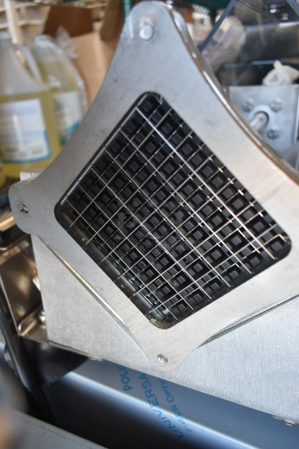 Industrial metal grid device, likely a food processor part, in good condition. Stainless steel and black components.