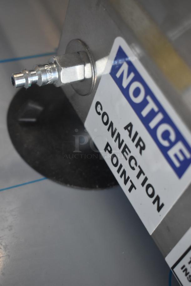 Air connection point with metal fitting, labeled "Notice: Air Connection Point," mounted on a flat metal surface.