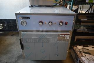 SlowPro cooking appliance with dials for cook and hold temperature, timer, and gauge. New condition with protective film.