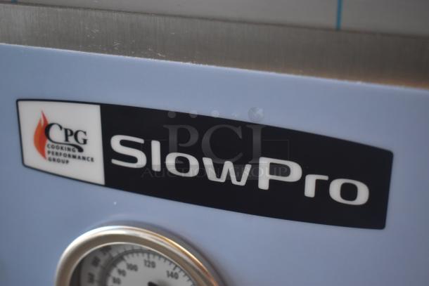 CPG SlowPro cooking appliance with temperature gauge, stainless steel finish. Brand logo and name visible on label.