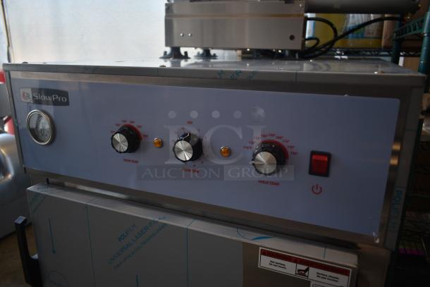 SlowPro cooking appliance with temperature and time controls, stainless steel finish, warning label, excellent condition.
