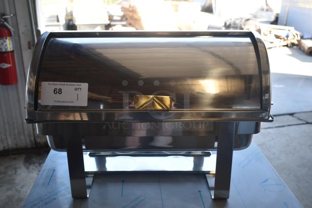 Stainless steel roll-top chafing dish in excellent condition, with brass handle detail, auction tag "68" visible.