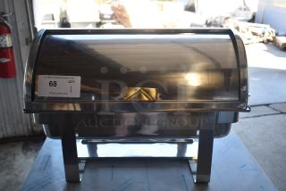 Stainless steel roll-top chafing dish in excellent condition, with brass handle detail, auction tag "68" visible.