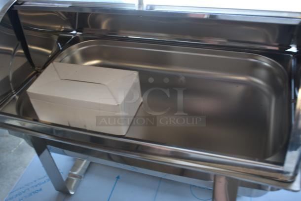 Stainless steel chafing dish with lid, in excellent condition, includes a white cardboard insert.