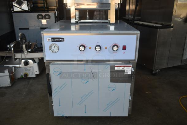 SlowPro commercial cooking appliance with temperature gauges and control knobs, new condition, protective film visible.