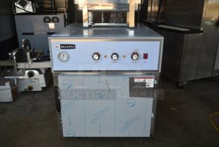 SlowPro commercial cooking appliance with temperature gauges and control knobs, new condition, protective film visible.