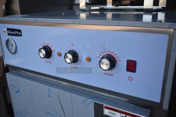 SlowPro commercial oven with adjustable knobs for cook temp, cook time, and hold temp; features a gauge and power button.