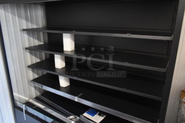 Black metal shelving unit with adjustable shelves, foam supports, new condition, includes assembly instructions.