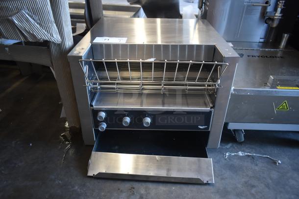 Commercial conveyor toaster with stainless steel finish, three control knobs, and crumb tray. Model: Vollrath. Good condition.
