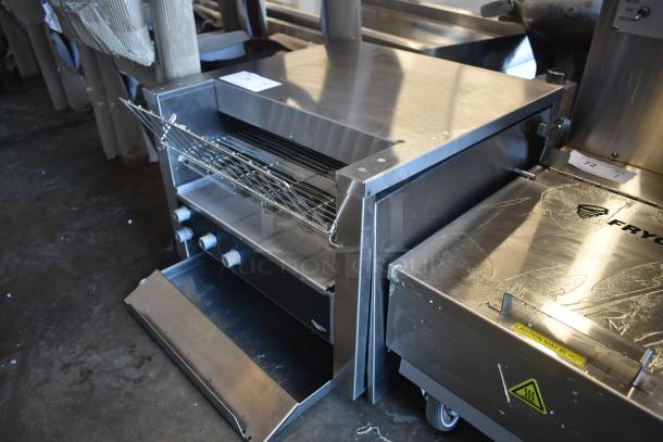 Commercial countertop toaster oven with wire rack, stainless steel, three control knobs, in good condition, labeled "Fryco".