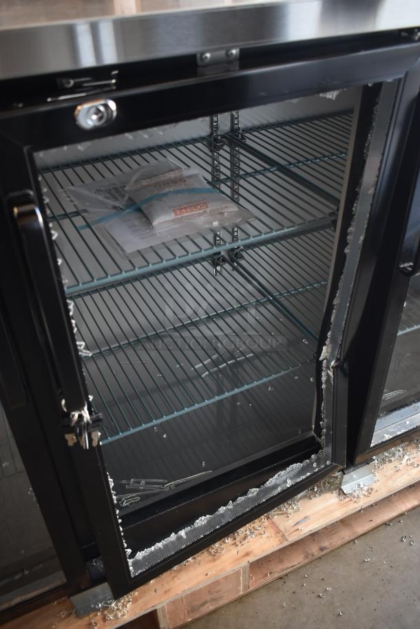 Commercial glass-door refrigerator with lock system, showcasing shelving and damaged glass door. Tags inside for parts and maintenance.