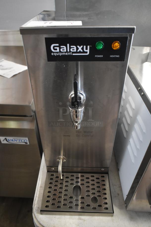 Galaxy hot water dispenser, stainless steel, power and heating indicators, warning label, used condition.