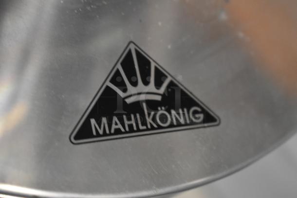 Mahlkönig coffee grinder logo detail on stainless steel surface, indicating brand authenticity and quality.