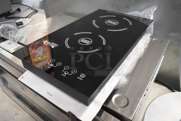 Countertop induction cooktop with two burners, branded Avantco. Features touch controls. Appears in new condition.