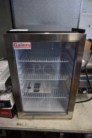 Galaxy Equipment countertop display fridge with stainless steel frame, glass door, three adjustable shelves, and visible power cord.