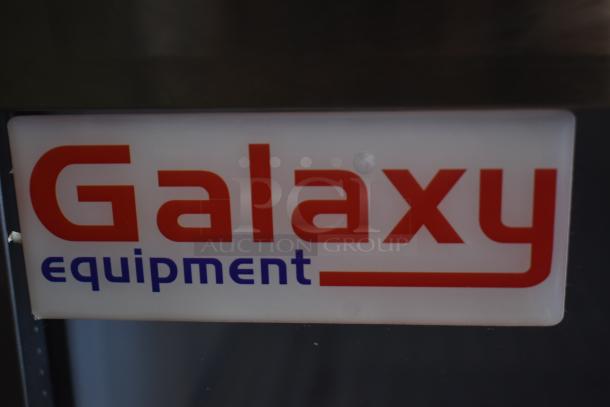"Galaxy Equipment" label in red and blue font on equipment surface.