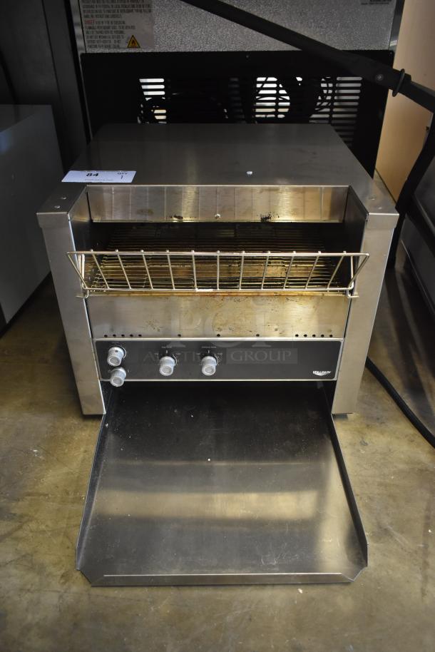 Conveyor toaster with stainless steel body, open chute, and 3 control knobs. Slightly used condition, item number 84.