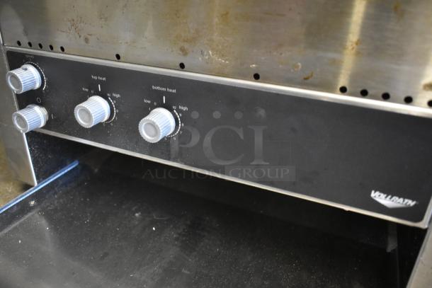 Vollrath commercial toaster with adjustable heat dials. Black front panel with speed and heat controls. Used condition.