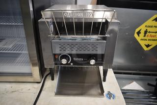 Galaxy conveyor toaster in stainless steel, featuring adjustable knobs for bread and buns settings, labeled "Caution Hot."